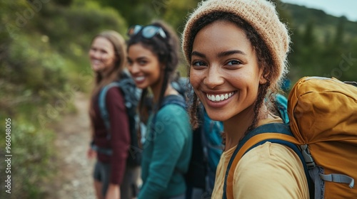 smiling diverse female hikers enjoying an outdoor adventure and showcasing friendship and happiness during a nature hiking journey