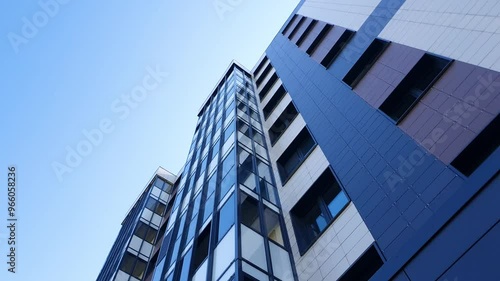 A residential apartment building from top to bottom. Commercial real estate, building. Buying, renting real estate. City apartments.