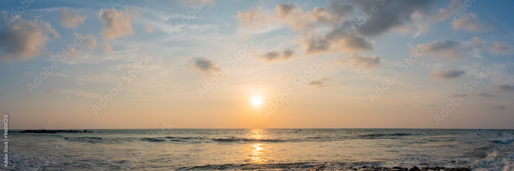 Dramatic panorama sky with cloud on sunrise and sunset time at a beach. Panoramic image. Dramatic panorama sky with cloud on sunrise and sunset time at a beach. Panoramic image.