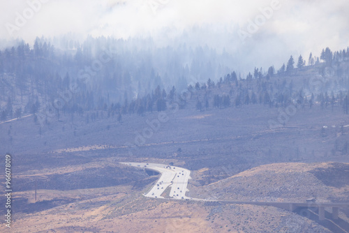 Poor visibility looking through smoke at traffic allowed on I-580 in Washoe Valley south of Reno during the Davis fire