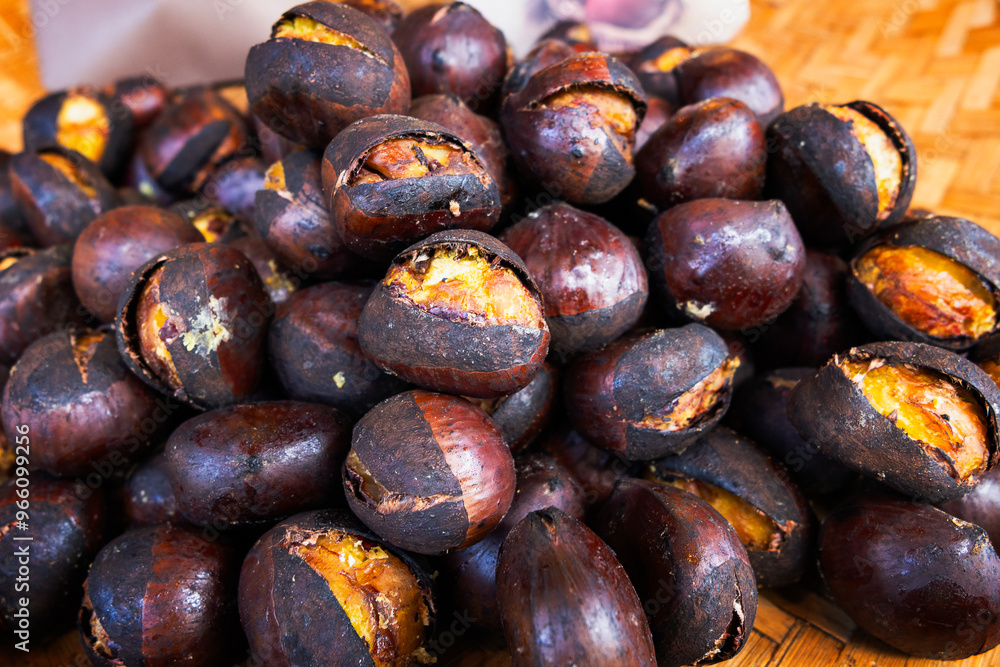 Japanese chestnuts are roasted until ripe and ready for sale. Japanese chestnuts are roasted until ripe and ready for sale.