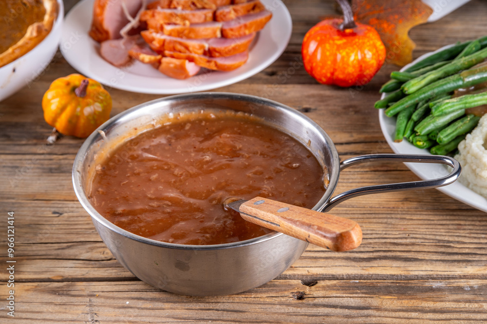 Homemade gravy sauce in small pot Homemade gravy sauce in small pot
