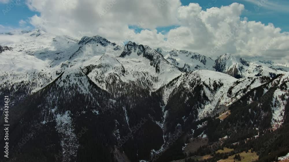 Aerial view of snowcapped mountains in clouds, Austrian Alps, Austria, 4k Aerial view of snowcapped mountains in clouds, Austrian Alps, Austria, 4k