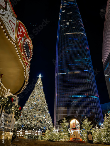 Obraz na płótnie Christmas pine tree near Lotte World Tower. Seoul city, South Korea. w salonie