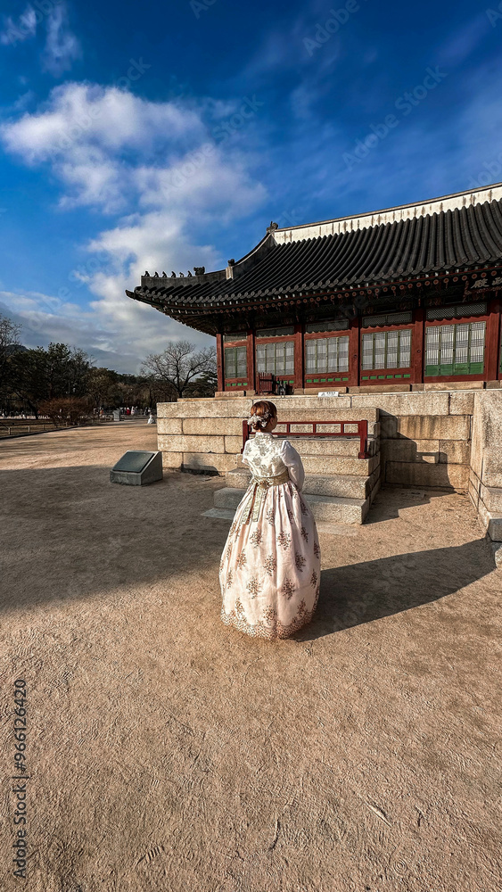 Tourist in national clothes walk in Gyeongbokgung Palace