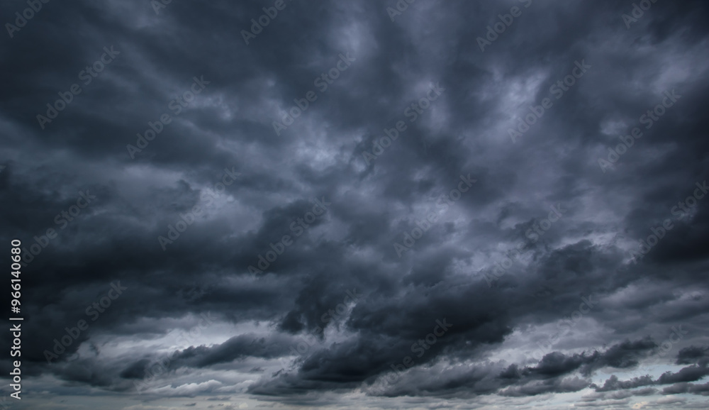 Bad or moody weather sky and environment. carbon dioxide emissions, greenhouse effect, global warming, climate change. The dark sky with heavy clouds converging and a violent storm before the rain. Bad or moody weather sky and environment. carbon dioxide emissions, greenhouse effect, global warming, climate change. The dark sky with heavy clouds converging and a violent storm before the rain.