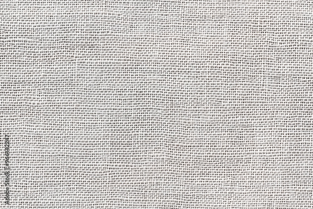 Textured cotton canvas fabric with a light gray color. The weave pattern is visible, showcasing the natural fibers and subtle variations in tone. Textured cotton canvas fabric with a light gray color. The weave pattern is visible, showcasing the natural fibers and subtle variations in tone.