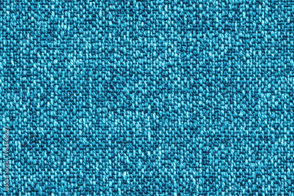 Textured turquoise cotton chenille fabric, showcasing a woven pattern with varying shades of blue. Textured turquoise cotton chenille fabric, showcasing a woven pattern with varying shades of blue.