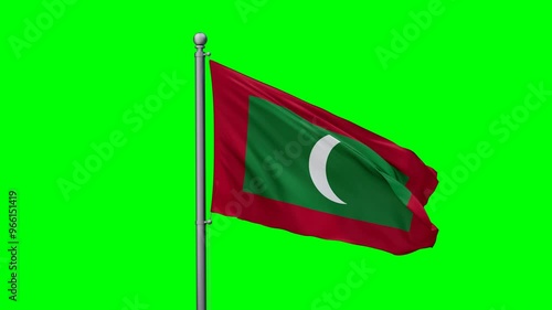 Maldives flag waving in the wind with colored chroma key with green background photo