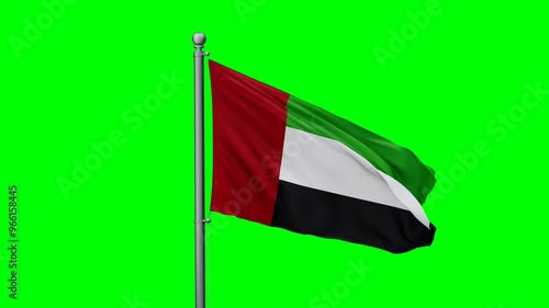 United Arab Emirates flag waving in the wind with colored chroma key with green background