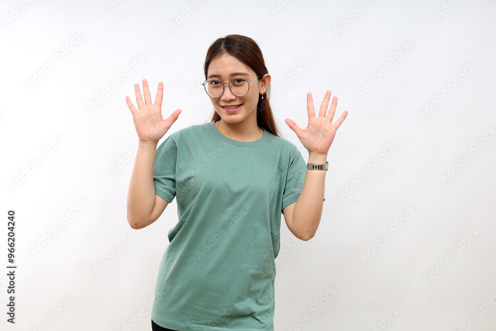 Smiling happy good-looking asian girl giving advice, showing ten fingers as explain rules, make point, standing white background Smiling happy good-looking asian girl giving advice, showing ten fingers as explain rules, make point, standing white background