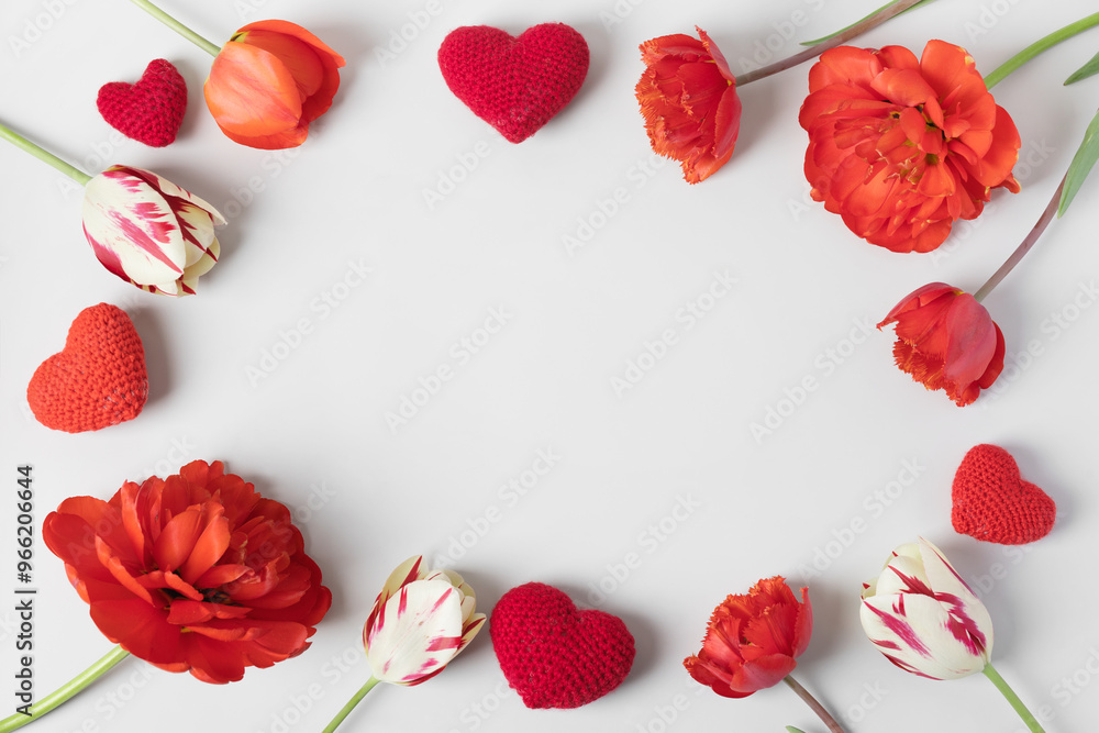 Happy Valentine's Day, Mother's Day and birthday greeting card. Red tulips and knitted red hearts on gray background Happy Valentine's Day, Mother's Day and birthday greeting card. Red tulips and knitted red hearts on gray background