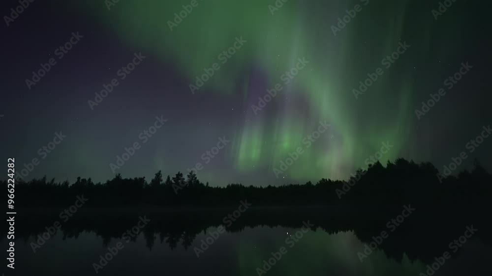 Shooting star among full-sky auroras reflecting from a lake, real-time video Shooting star among full-sky auroras reflecting from a lake, real-time video