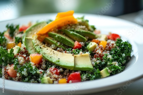 Vibrant kale salad topped with avocado, mango, and quinoa, showcasing a healthy and fresh meal option for fitness enthusiasts. photo