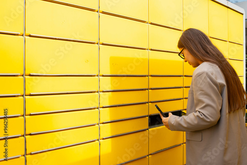 Parcel locker with open door and package inside. photo