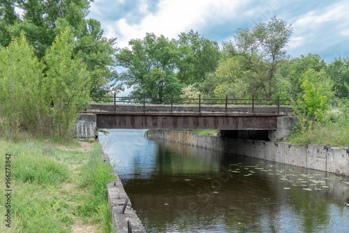 Картината върху платно Iron concrete bridge over the river canal