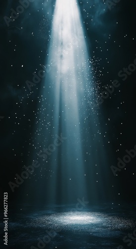 Radiant beams of light shining through a dark space with floating particles i...