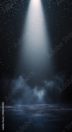 Radiant beams of light shining through a dark space with floating particles i...