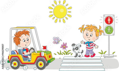 Little boy driving a small ...