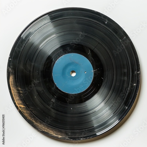 A vintage vinyl record, partially out of its sleeve, isolated on a white background. Clear lighting enhances the glossy surface and vibrant label.