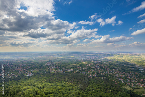 A city view with a blue sky and clouds