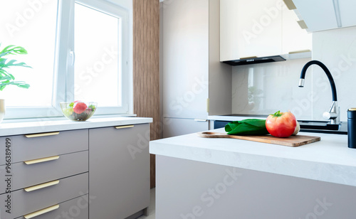 Modern interior of kitchen with stlish furniture, white counter and black kitchen sink with faucet. Window and stylish design in new apartment. Real estate.	 photo