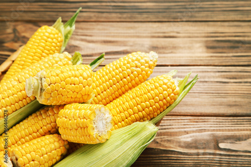 Ripe corn on brown wooden table