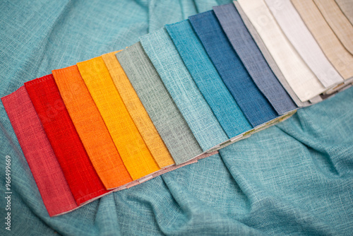 Bright samples of textured fabric for curtains. Red, yellow and green fabric samples. photo