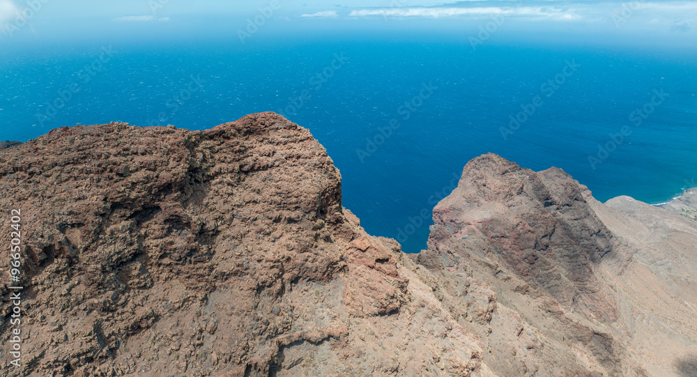 Aerial view of the trail through the mountains to Guigui beach, pristine black sand beach, Gran Canaria. Spain. Scenic trail
Aerial view of the trail through the mountains to Guigui beach, pristine black sand beach, Gran Canaria. Spain. Scenic trail