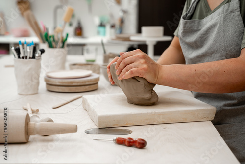 Fotografie Removing air bubbles from clay before modeling to avoid the ruination of a ceramic product