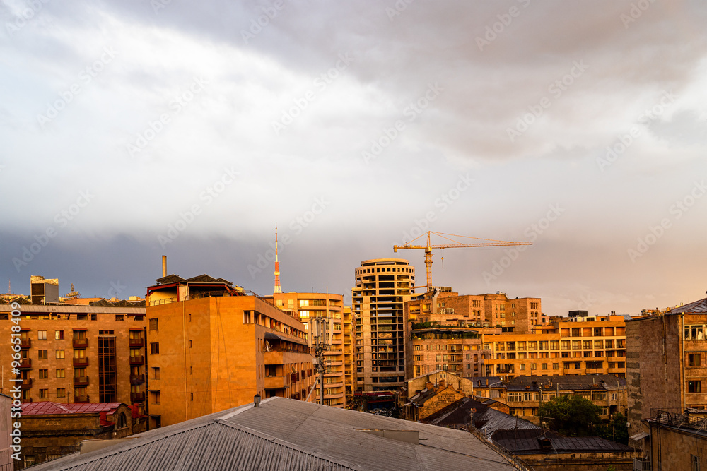 Fototapeta premium cloudy evening sky over Yerevan residential area