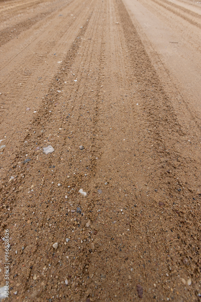 close-up of a part of a wet road without asphalt close-up of a part of a wet road without asphalt