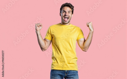 breathtaking HDR photo of Portrait of gorgeous young man raise fists wear yellow, excited TEE SHIRT isolated on pink color backgroundlora:flux_realism_lora:1>, blue jean pant, look at camera 