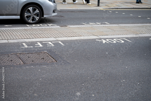 Transportation in London city, roads, road signes, street signes, warnings, indicating of directions in Great Britain, city life in England photo