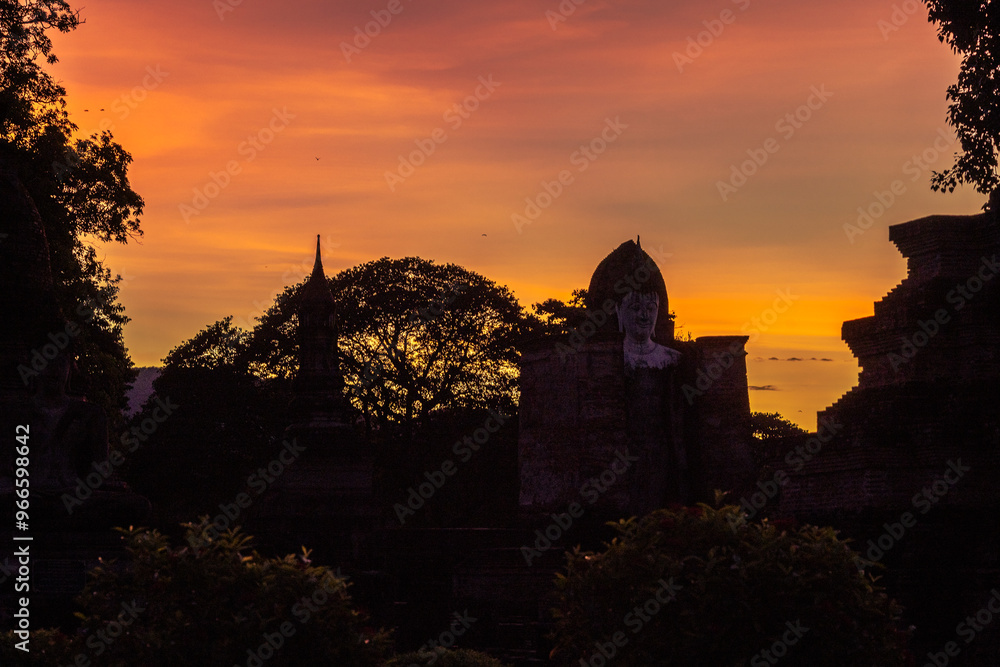 Fototapeta premium Background atmosphere inside the important historical tourist attraction Sukhothai Historical Park,foreign tourists from all over the world like to bring their children study history during holiday.