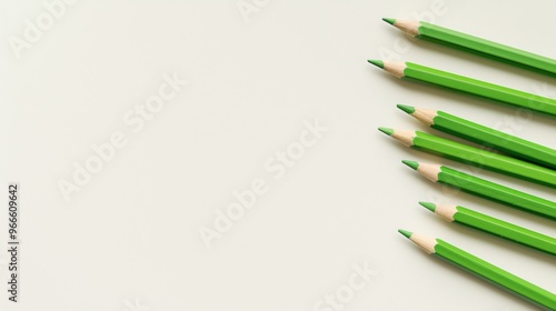 Green Pencil on a White Background, Top View, Flat Lay, Minimalistic Style, Ideal for School Education or Creative Work Theme