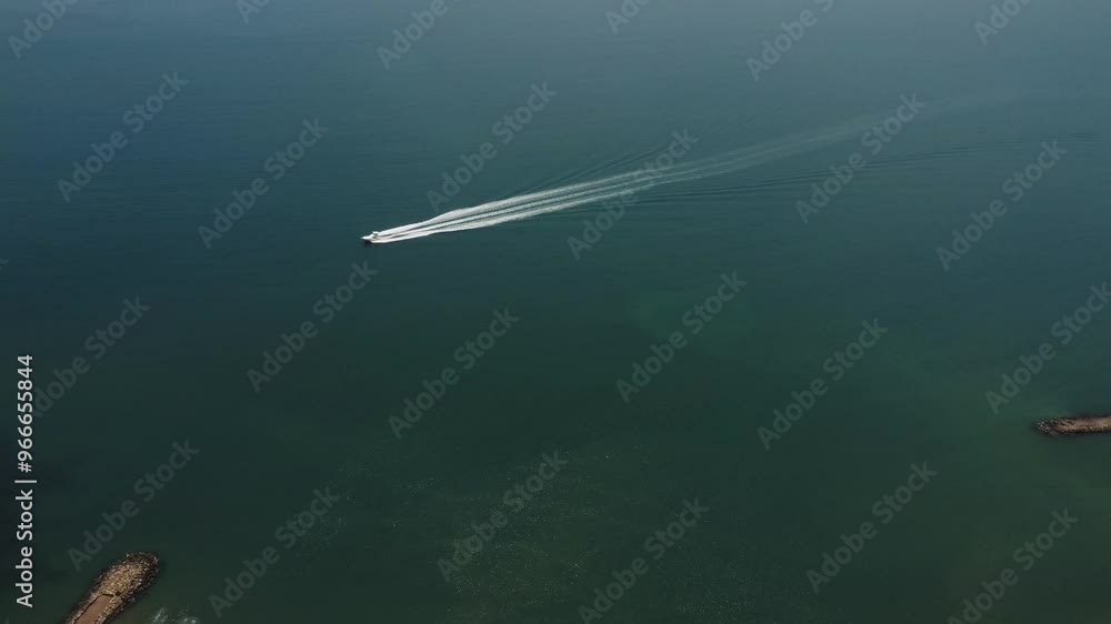 Aerial tracking by drone of a boat, sailing on the beaches of Lechería Aerial tracking by drone of a boat, sailing on the beaches of Lechería