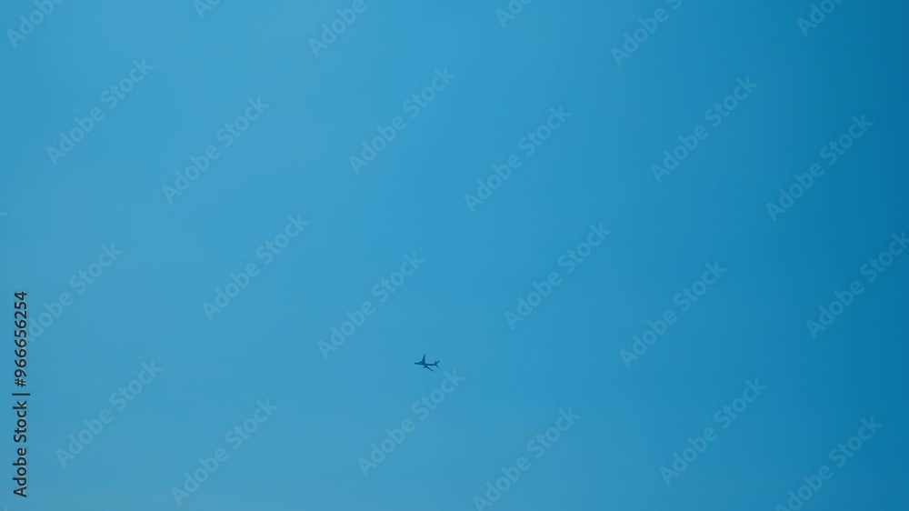 Plane passing by over a blue sky Plane passing by over a blue sky
