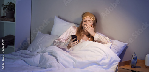 Young woman with mobile pho...