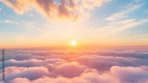 Fototapeta Naklejka Na Ścianę i Meble -  The sun sets, casting golden hues and vibrant colors across the sky while illuminating the clouds beneath with a warm glow