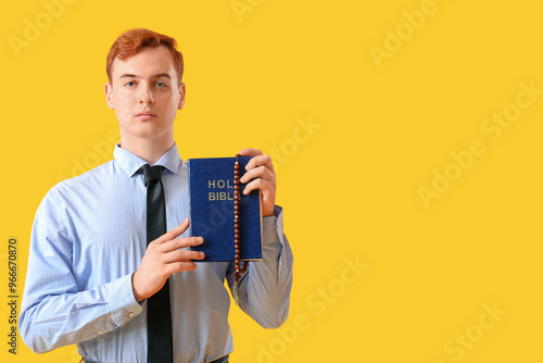 Young redhead man with Bibl...