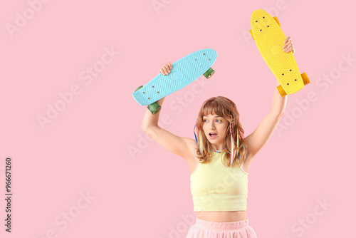 Young woman with skateboard...