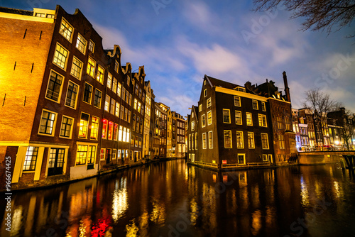 Amsterdam canal Singel with typical dutch houses during twilight, Holland, Netherlands.