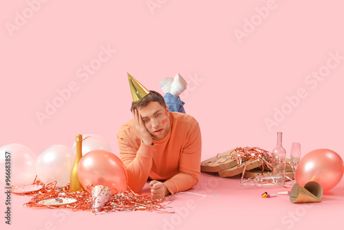 Young man with hangover and...