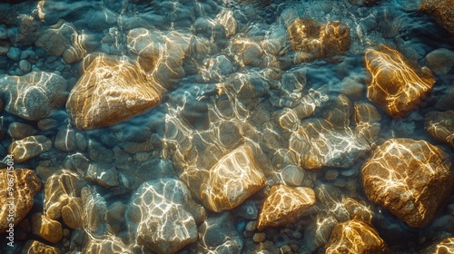 Sunlit Riverbed with Smooth Stones and Rippling Water