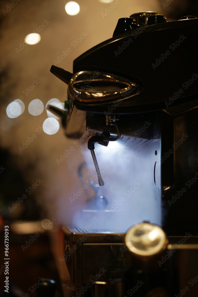 Naklejka premium Coffee machine in a steam at cafe