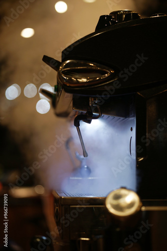 Coffee machine in a steam at cafe