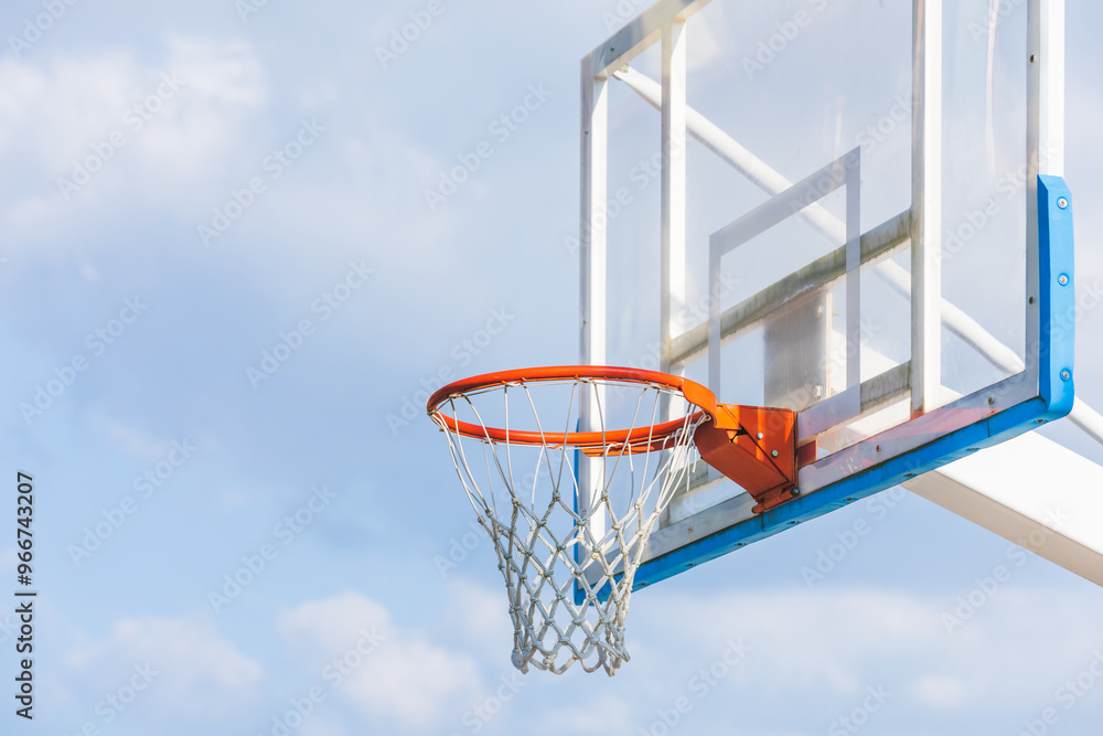 Close-up of a basketball hoop on a sunny afternoon. rim, net Close-up of a basketball hoop on a sunny afternoon. rim, net