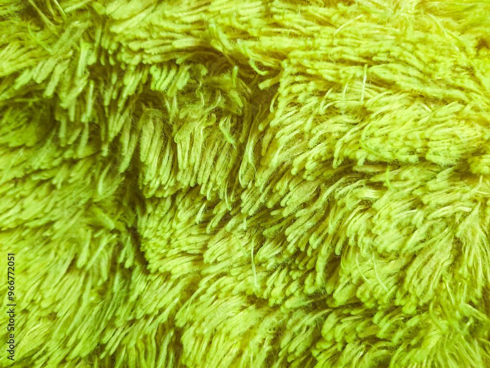 Soft pillowcase texture made of wool yarn. Light green background Soft pillowcase texture made of wool yarn. Light green background