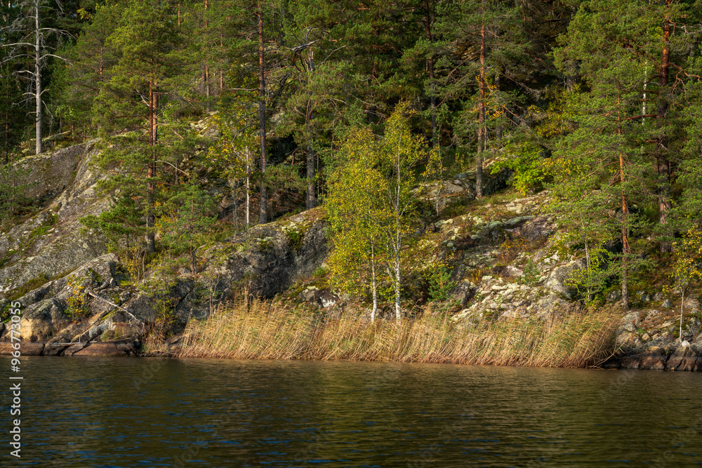 View of the rocky shores of Lake Ladoga near the village of Lumivaara on a sunny autumn day, Ladoga Skerries, Lahdenpohya, Republic of Karelia, Russia View of the rocky shores of Lake Ladoga near the village of Lumivaara on a sunny autumn day, Ladoga Skerries, Lahdenpohya, Republic of Karelia, Russia